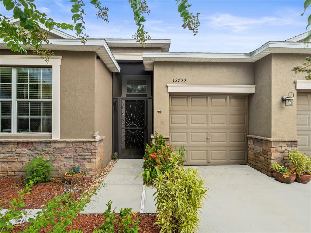 12722 Drakefield Drive Spring Hill, FL 34610 - Photo 3 of 45 a front view of a house