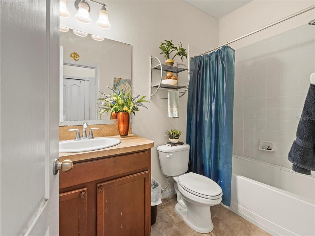 12722 Drakefield Drive Spring Hill, FL 34610 - Photo 38 of 45 a bathroom with a sink toilet and shower