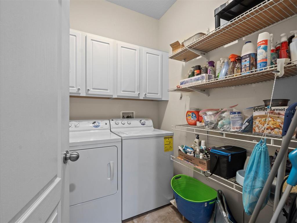 12722 Drakefield Drive Spring Hill, FL 34610 - Photo 40 of 45 a utility room with dryer and washer