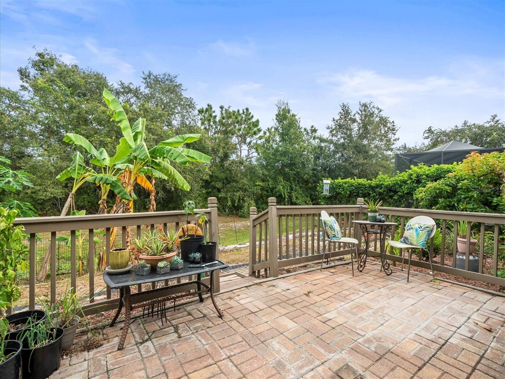 12722 Drakefield Drive Spring Hill, FL 34610 - Photo 43 of 45 a roof deck with table and chairs