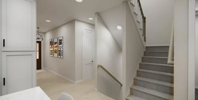 a view of entryway with furniture and wooden floor