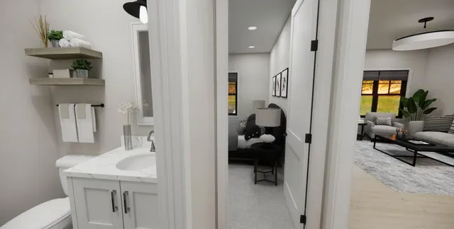 a en suite bathroom with a sink and a mirror