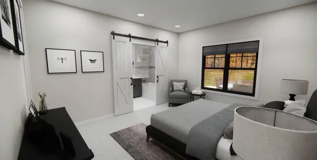 a spacious bedroom with a bed and a couch