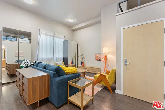 a view of a room that has a table and chairs in it