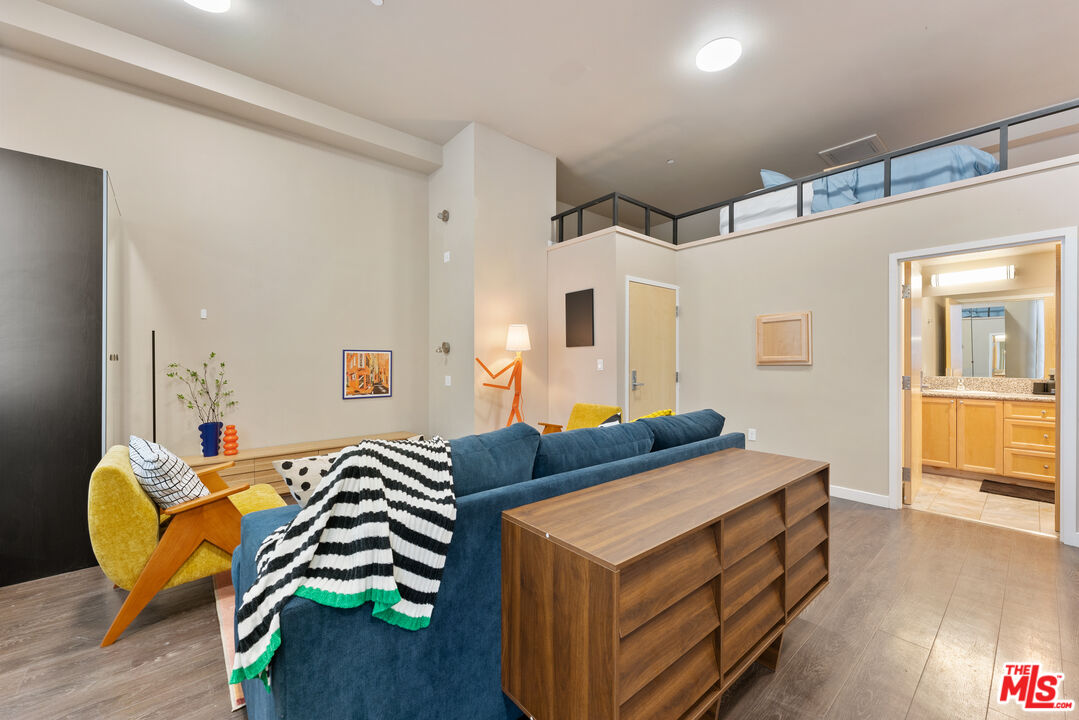 630 West 28th Street, Unit 4 Los Angeles, CA 90007 - Photo 17 of 33 a bedroom with furniture and a wooden floor