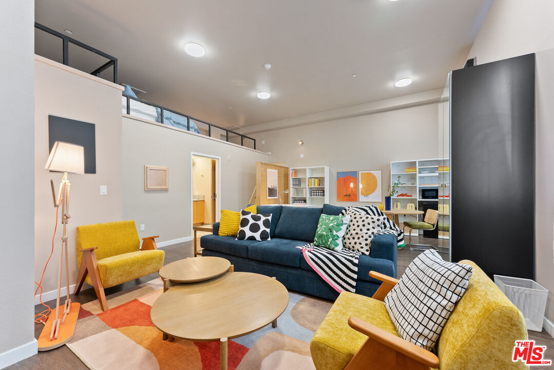 630 West 28th Street, Unit 4 Los Angeles, CA 90007 - Photo 18 of 33 a living room with furniture and a table