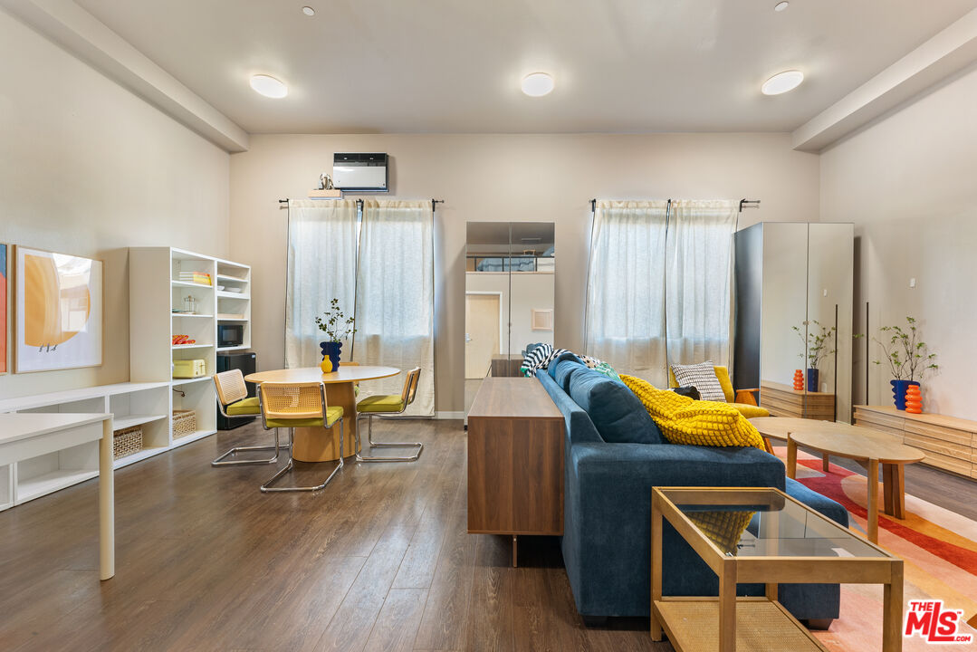 630 West 28th Street, Unit 4 Los Angeles, CA 90007 - Photo 19 of 33 a living room with furniture a large window and wooden floor