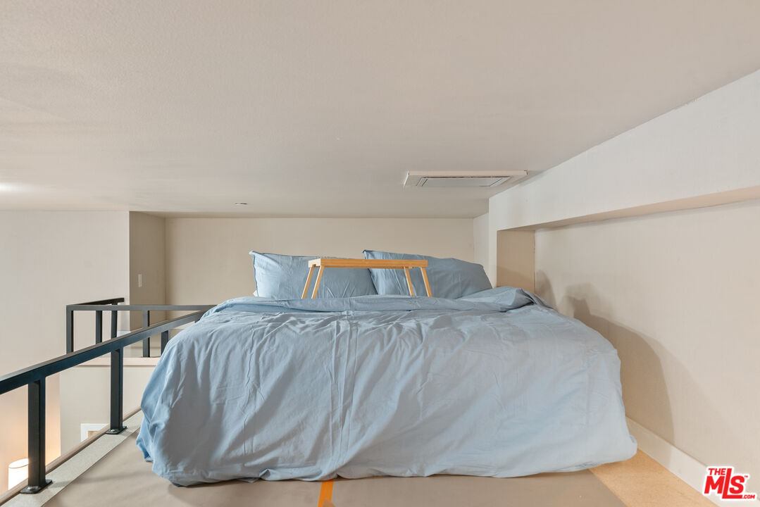 630 West 28th Street, Unit 4 Los Angeles, CA 90007 - Photo 30 of 33 a bedroom with a bed and a night stand