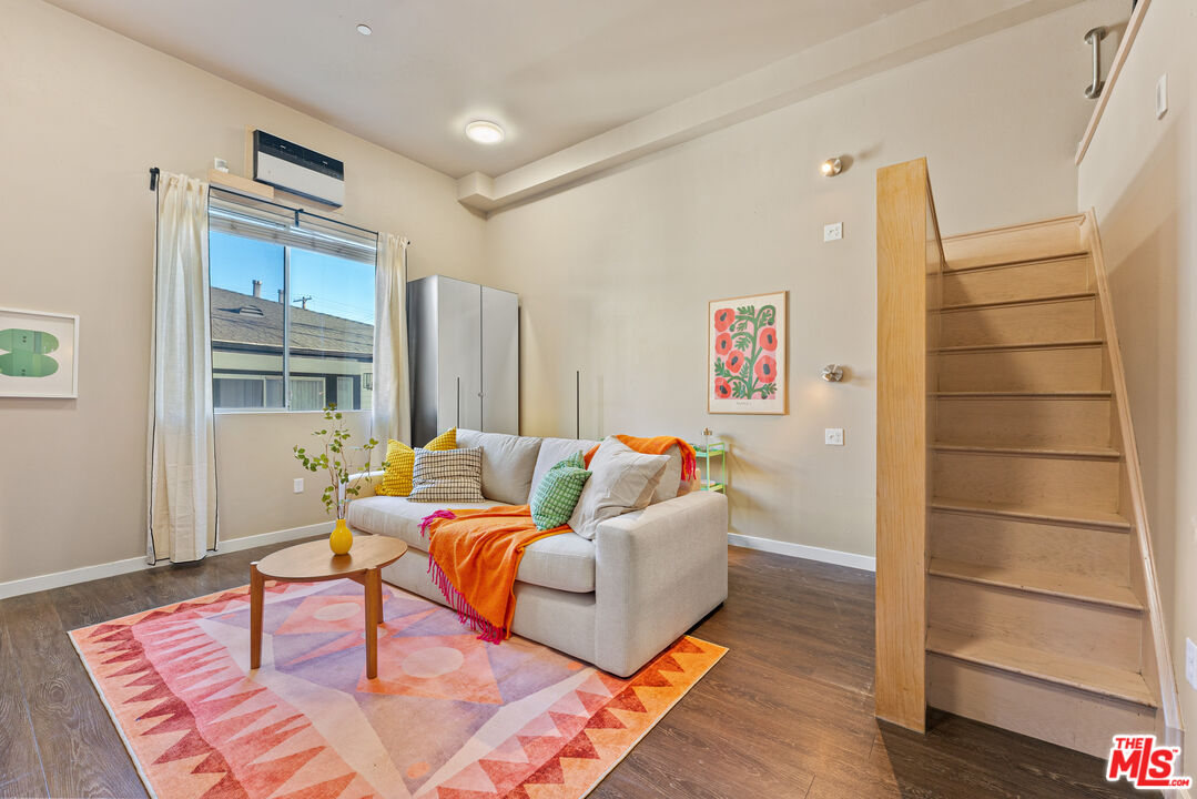 630 West 28th Street, Unit 4 Los Angeles, CA 90007 - Photo 3 of 33 a living room with furniture rug and wooden floor