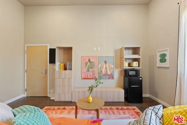a living room with furniture and a rug