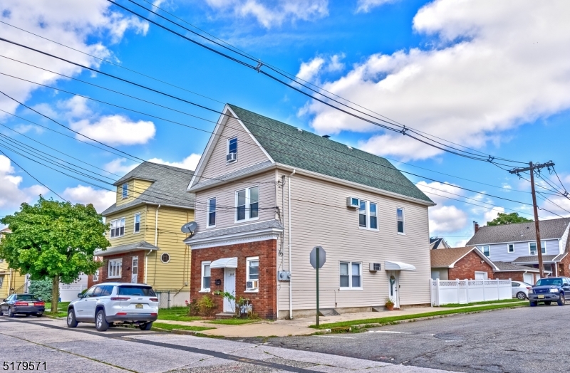 146 Main Street, Unit 2 Garfield, NJ 07026 - Photo 1 of 14 a view of multiple houses with a street
