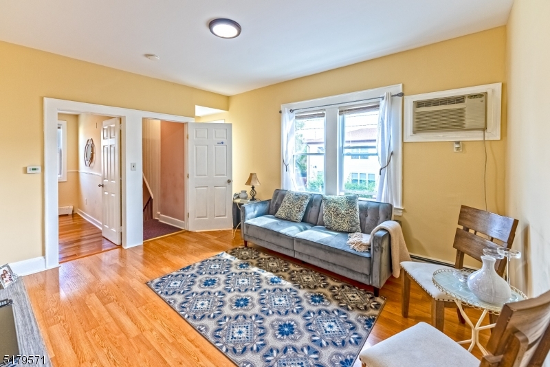 146 Main Street, Unit 2 Garfield, NJ 07026 - Photo 11 of 14 a living room with furniture and a rug