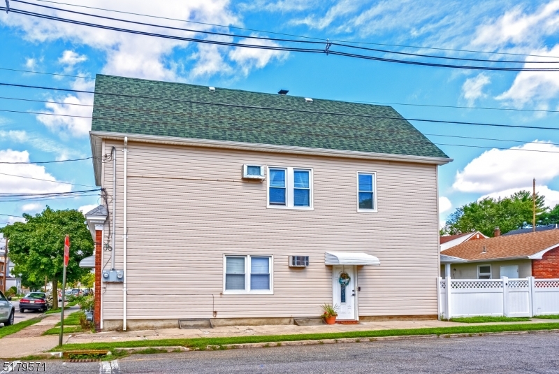 146 Main Street, Unit 2 Garfield, NJ 07026 - Photo 2 of 14 a front view of a house with a yard