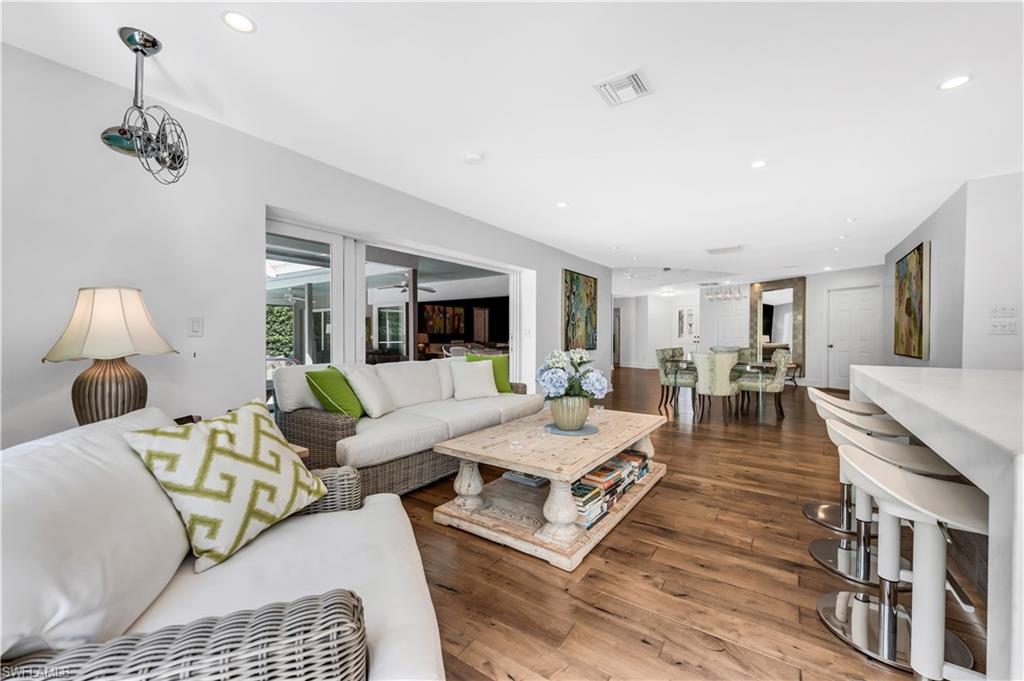 183 Edgemere Way South Naples, FL 34105 - Photo 8 of 42 Great room with recessed lighting and hardwood / wood-style floors