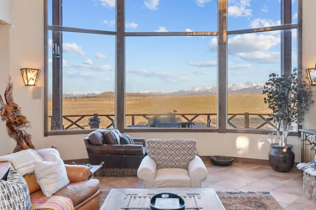 a very nice looking kitchen with a large window and stainless steel appliances