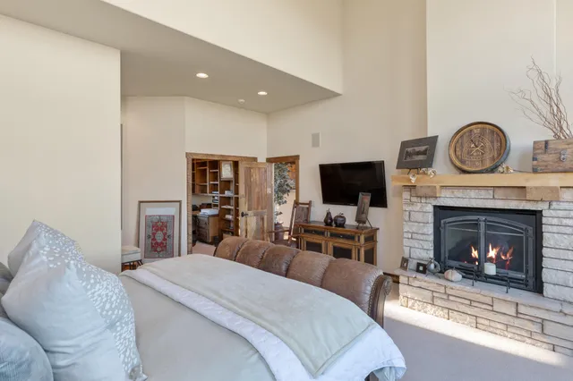 a room with furniture pool table and windows
