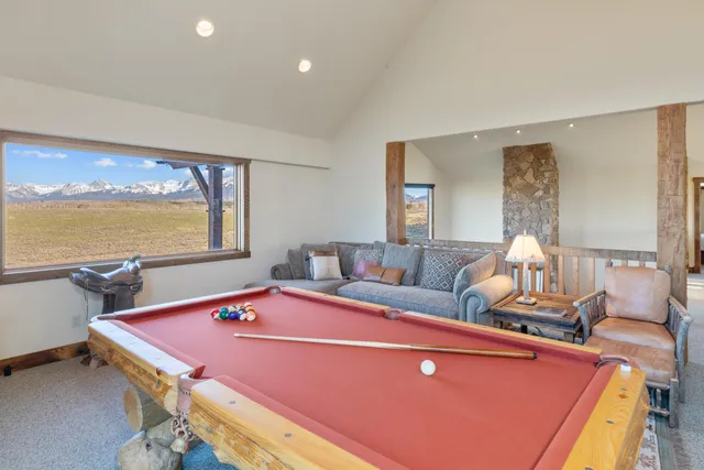 a bed room with a bed and a large window