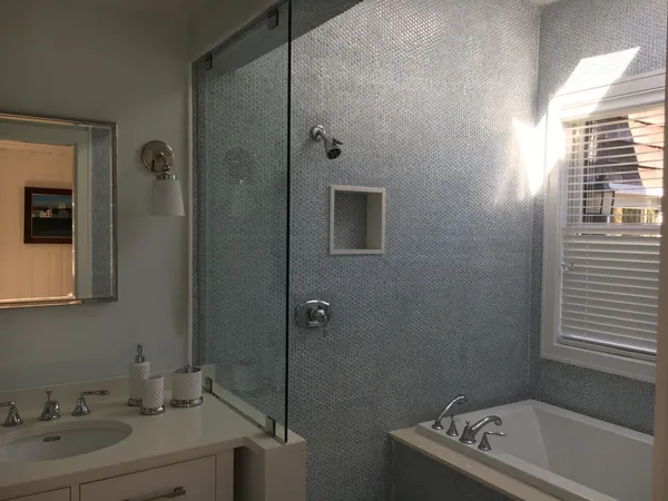 a bathroom with a sink toilet and shower