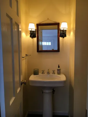 a bathroom with a sink and mirror