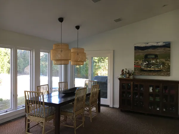 a view of a dining room with furniture window and outside view