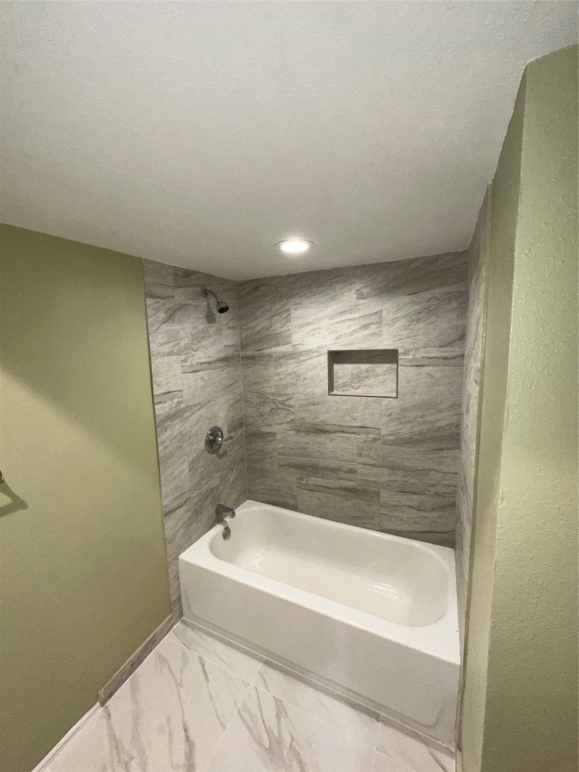 14663 Perthshire Road, Unit 14663 Houston, TX 77079 - Photo 13 of 35 a bathroom with a bathtub and shower