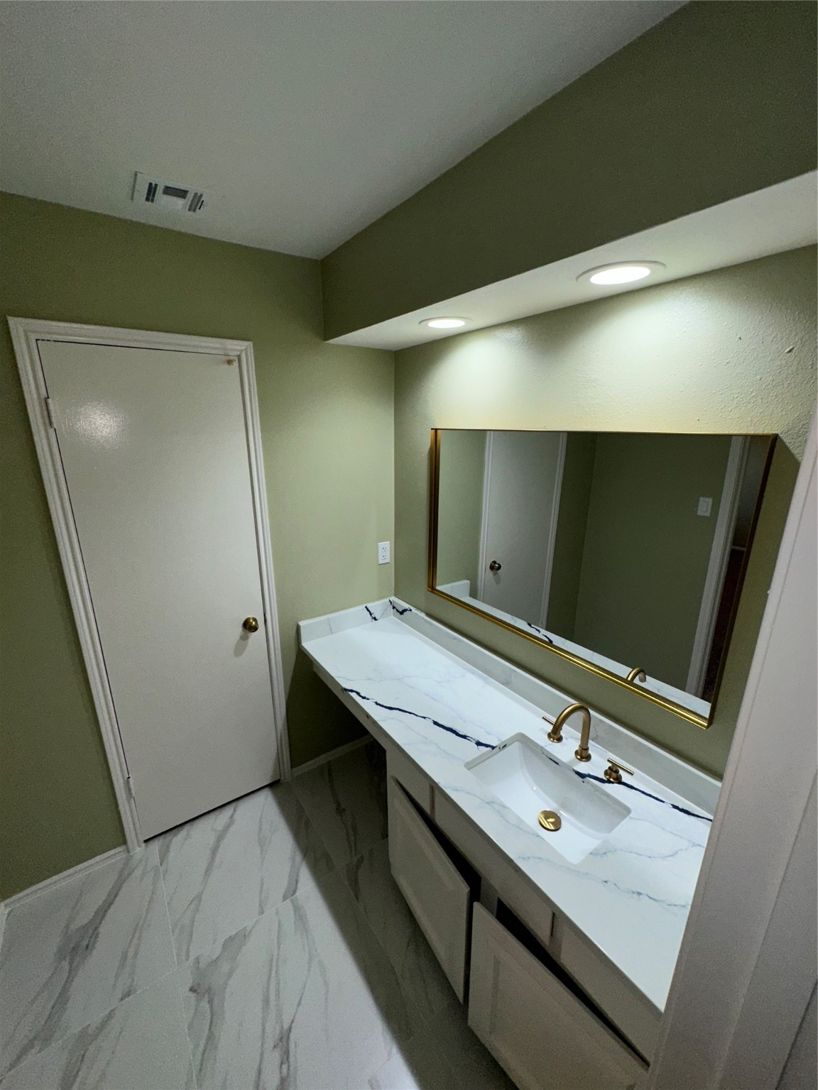 14663 Perthshire Road, Unit 14663 Houston, TX 77079 - Photo 15 of 35 a bathroom with a double vanity sink and mirror