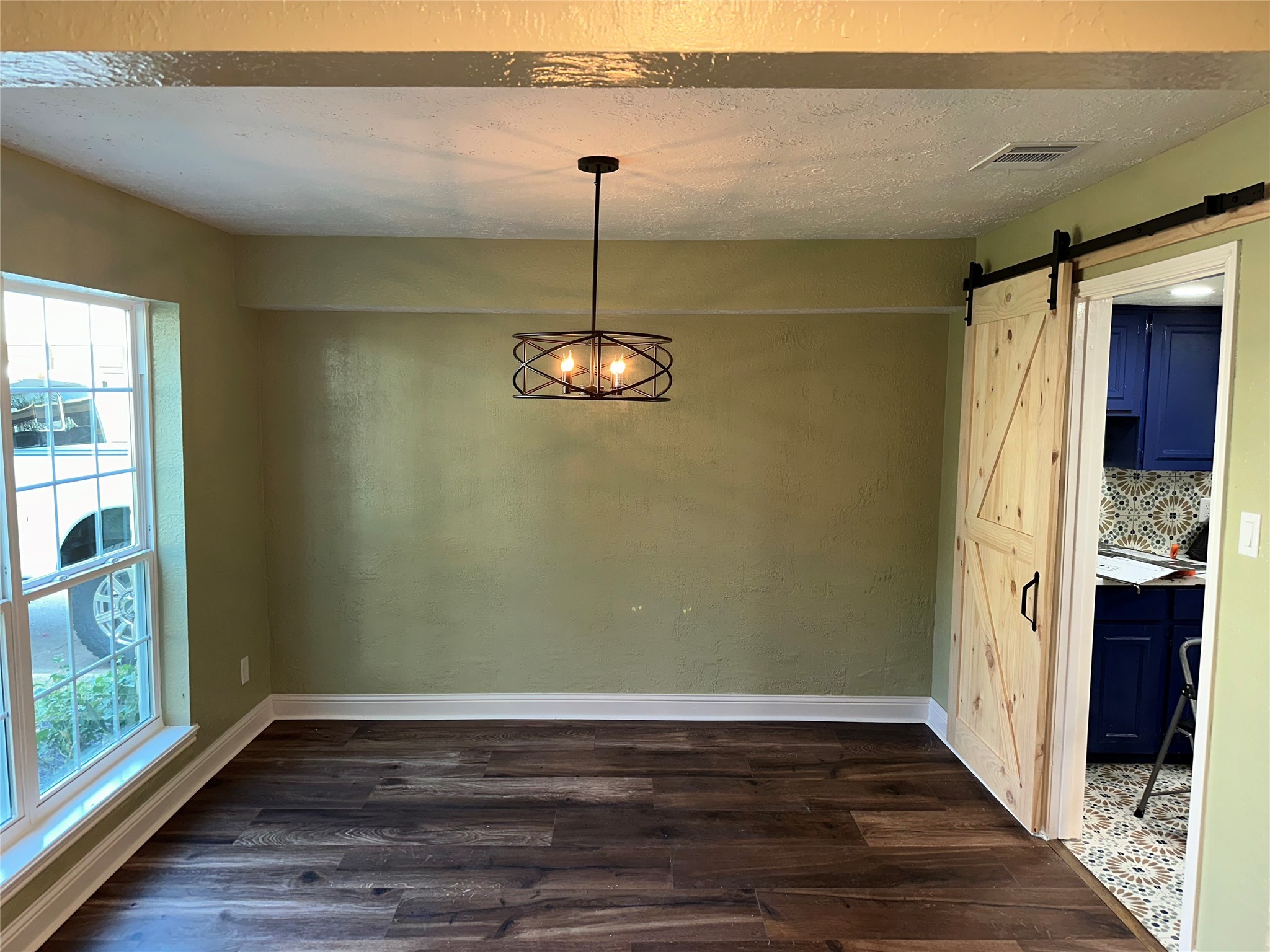 14663 Perthshire Road, Unit 14663 Houston, TX 77079 - Photo 2 of 35 a view of empty room with wooden floor and fan