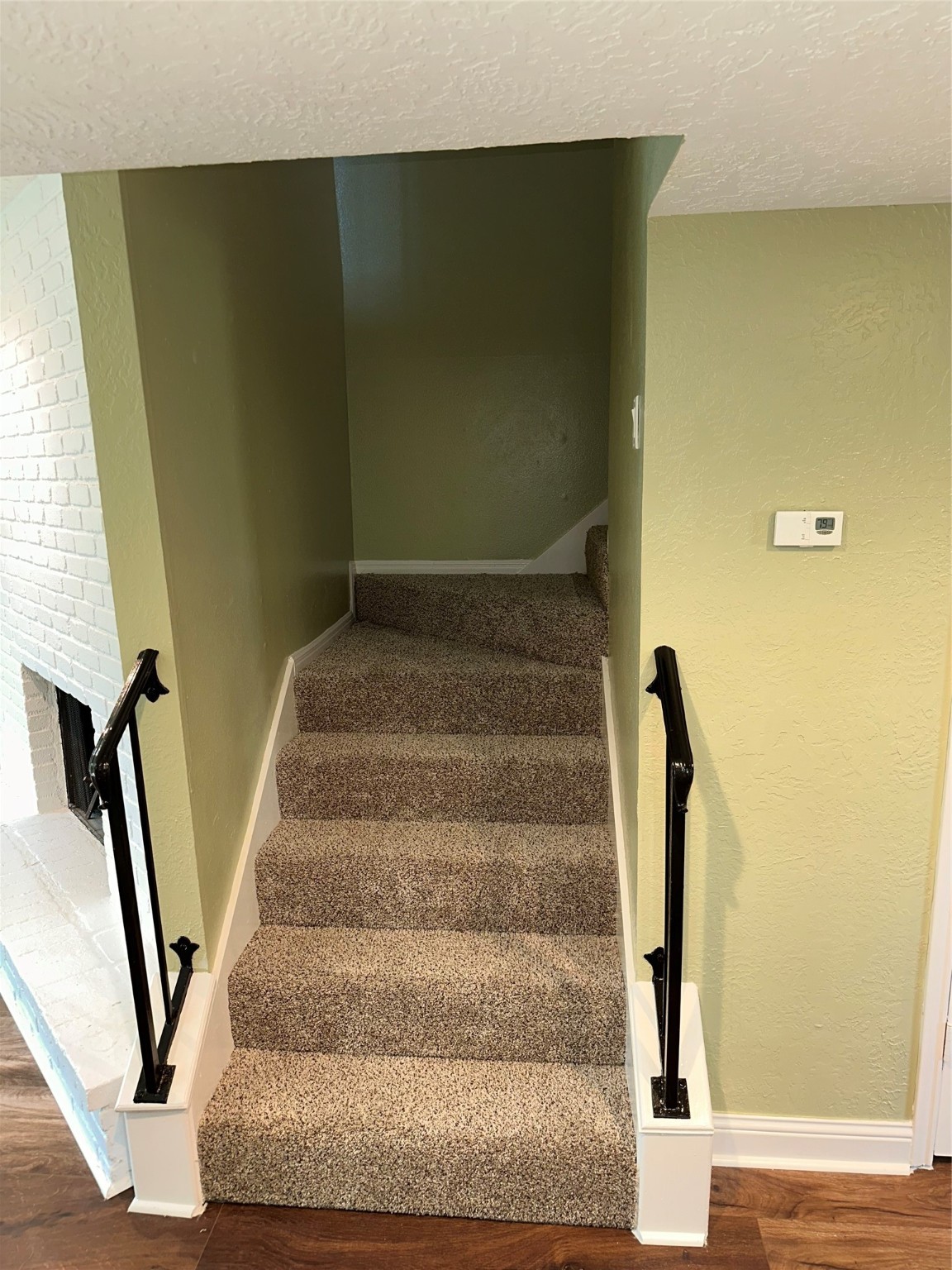 14663 Perthshire Road, Unit 14663 Houston, TX 77079 - Photo 22 of 35 a view of staircase with white walls and railing