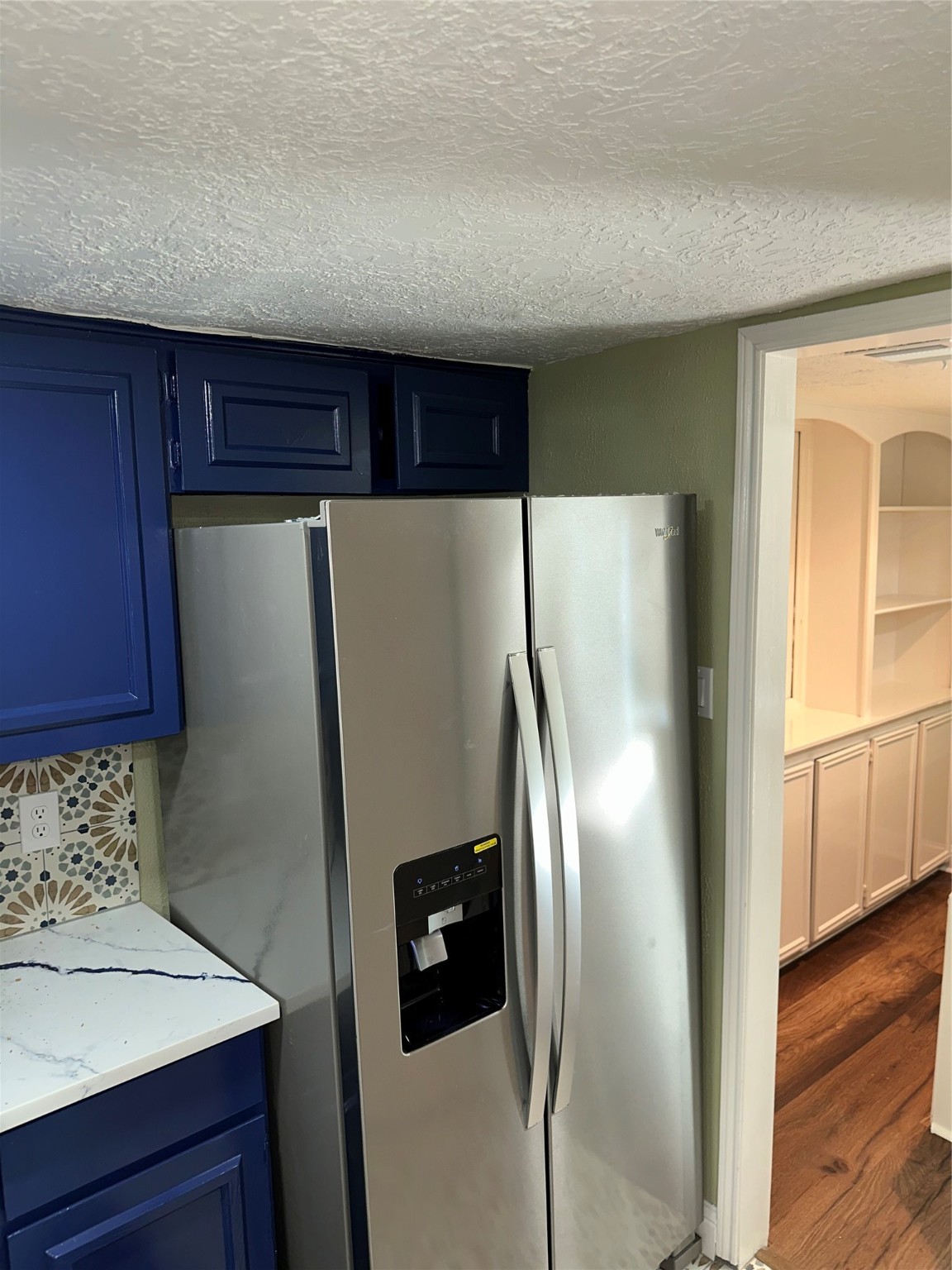14663 Perthshire Road, Unit 14663 Houston, TX 77079 - Photo 24 of 35 a metallic refrigerator freezer sitting in a kitchen