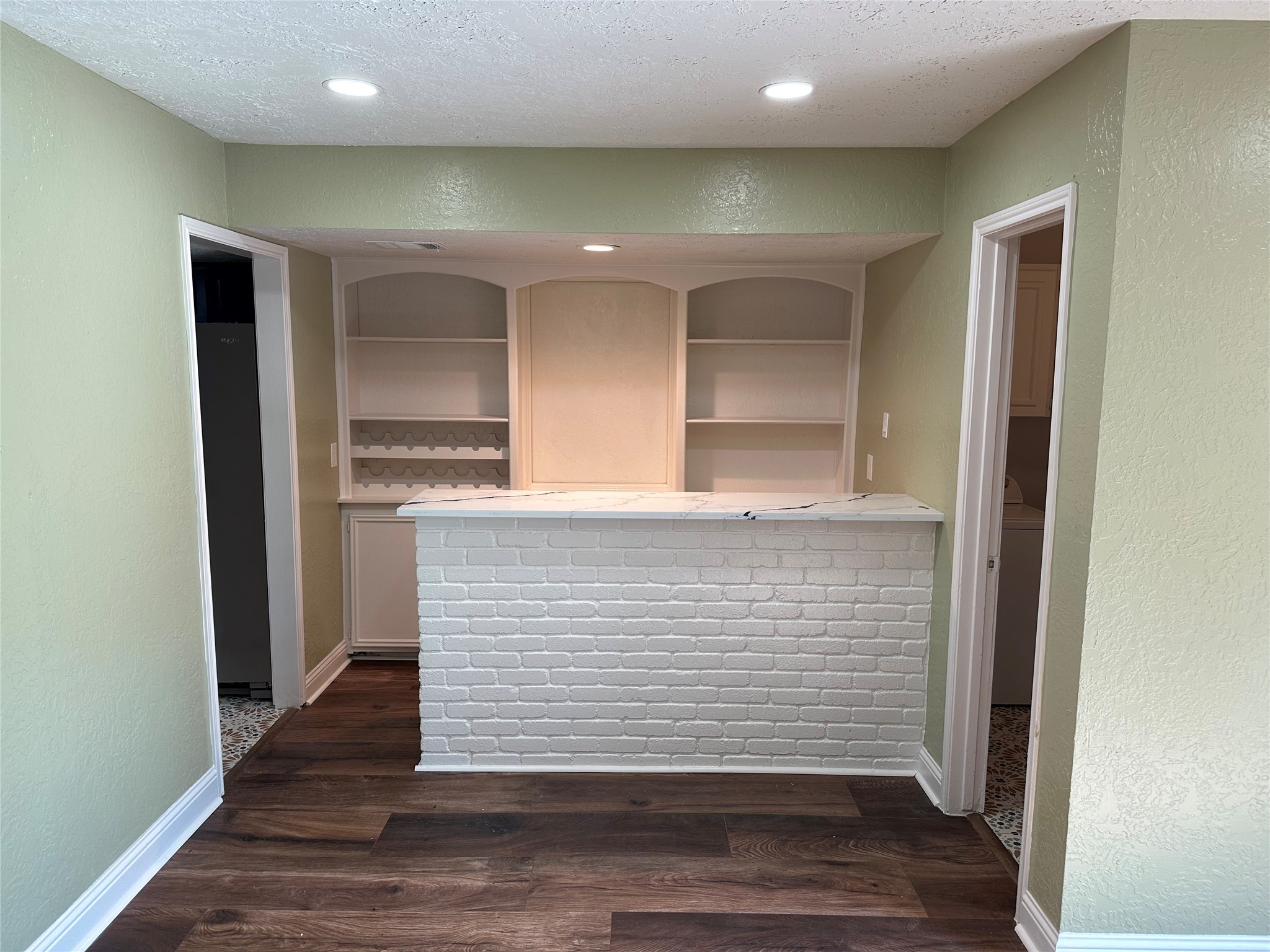 14663 Perthshire Road, Unit 14663 Houston, TX 77079 - Photo 5 of 35 a view of kitchen with cabinets and wooden floor