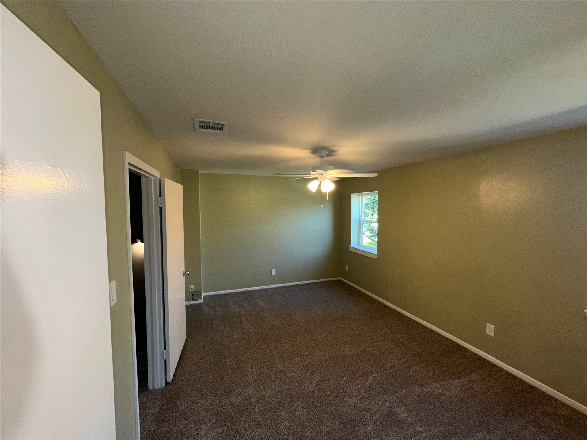 14663 Perthshire Road, Unit 14663 Houston, TX 77079 - Photo 8 of 35 an empty room with windows and closet