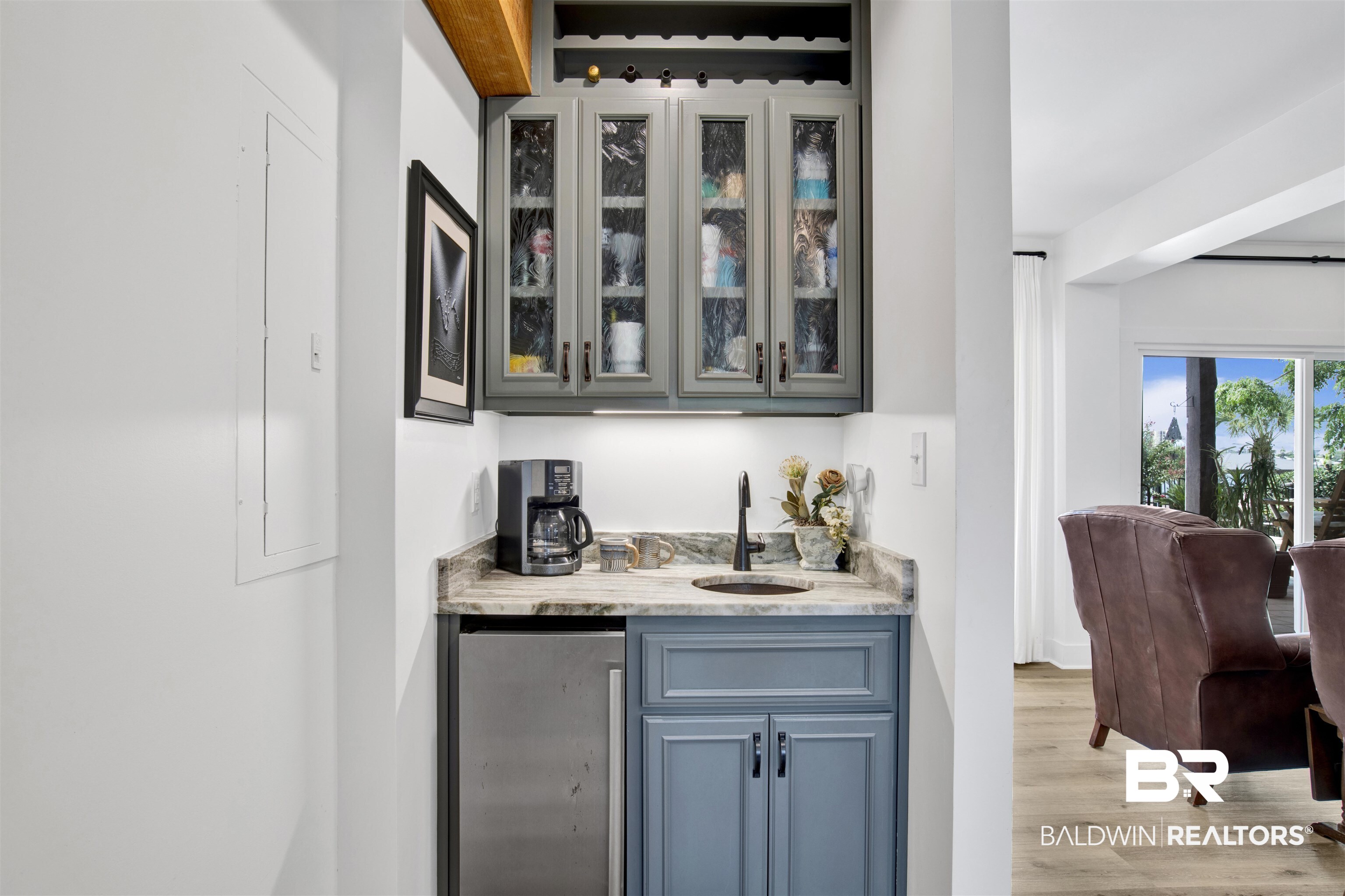30538 River Road Orange Beach, AL 36561 - Photo 44 of 78 Indoor wet bar with light wood-type flooring and refrigerator