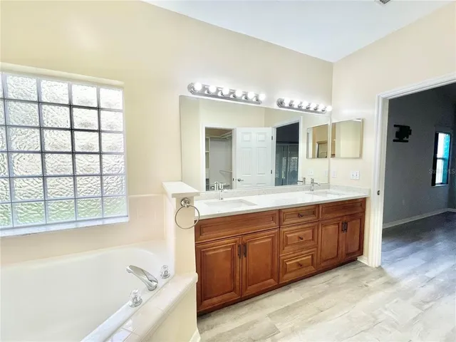 a bathroom with a glass shower door