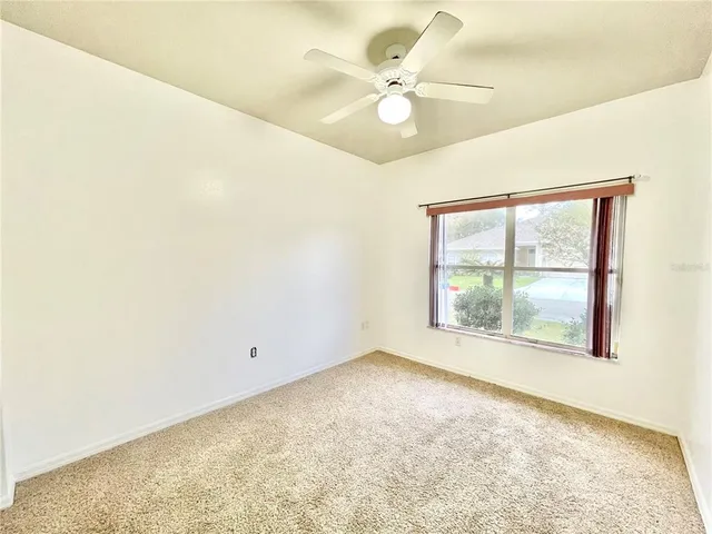 a bathroom with a double vanity sink toilet mirror and bathtub