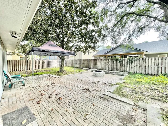 a view of swimming pool with palm trees