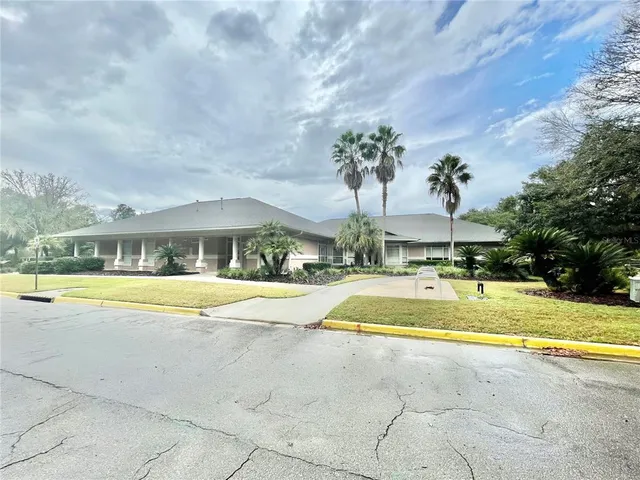 a white tub sitting in a room next to a large window