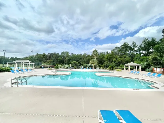 a view of a patio with a table chairs and a table