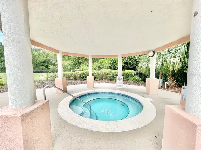 a gym room that has a lot of gym equipment