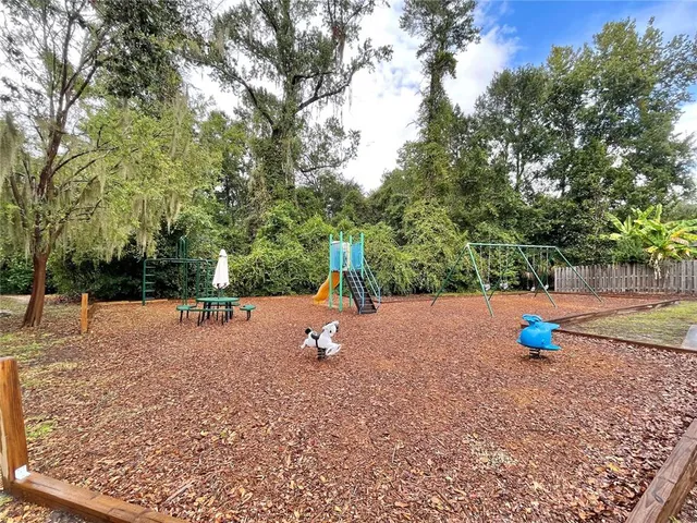 a kitchen with a refrigerator and a sink