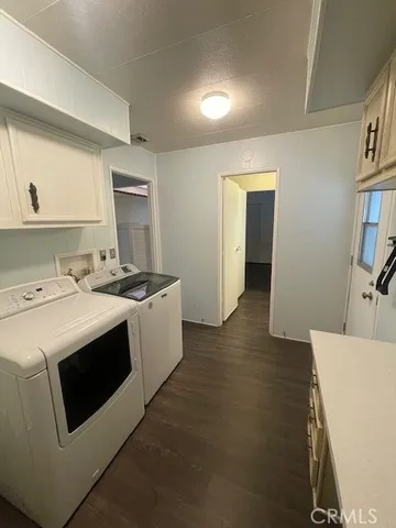 a utility room with washer and dryer