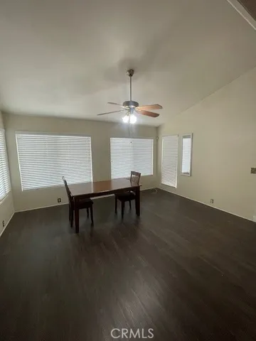 a view of a room with furniture window and wooden floor