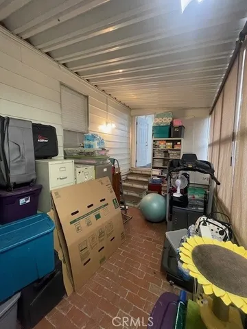 a room with furniture a table and flat screen tv