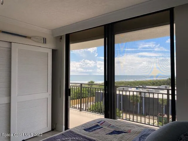 a view of a glass door with a balcony