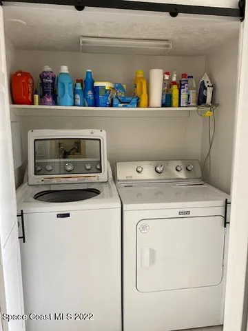 a utility room with washer and dryer