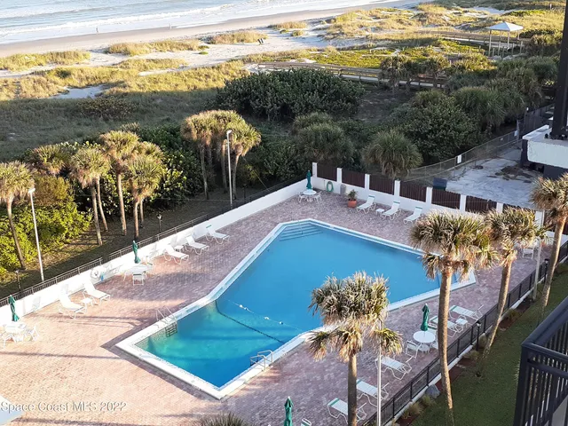 a view of a balcony with furniture