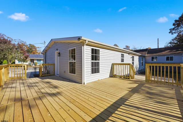 a front view of a house with wooden floor