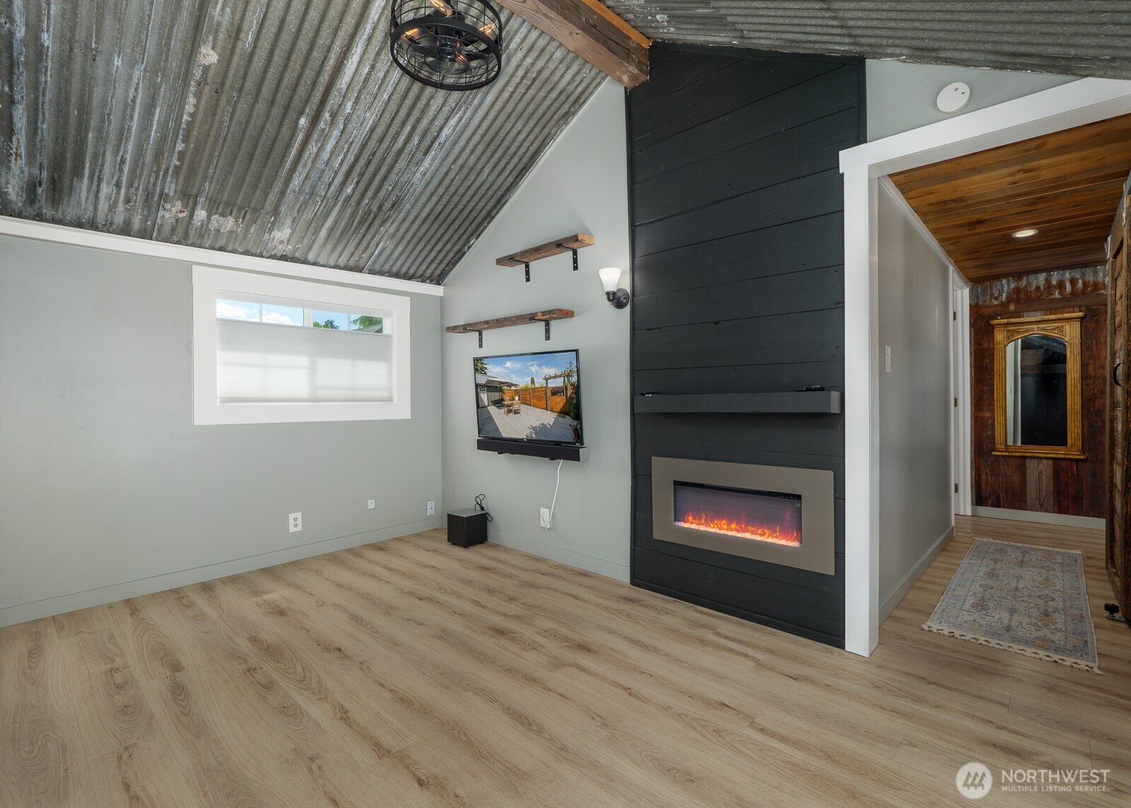 233 West Washington Street Sequim, WA 98382 - Photo 6 of 40 a view of empty room with a fireplace