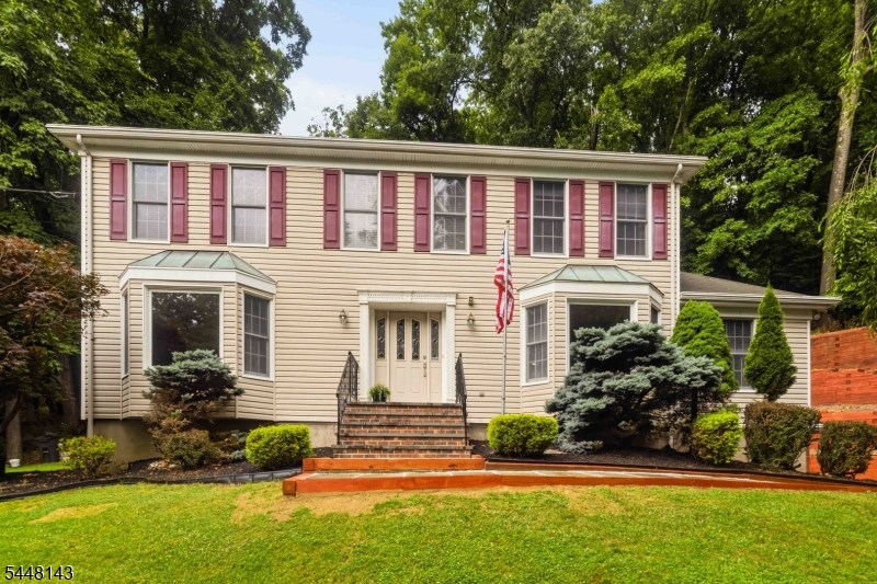 56 Union Hill Road Morris Plains, NJ 07950 - Photo 2 of 31 a front view of a house with a yard