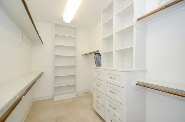 a view of an empty walk in closet