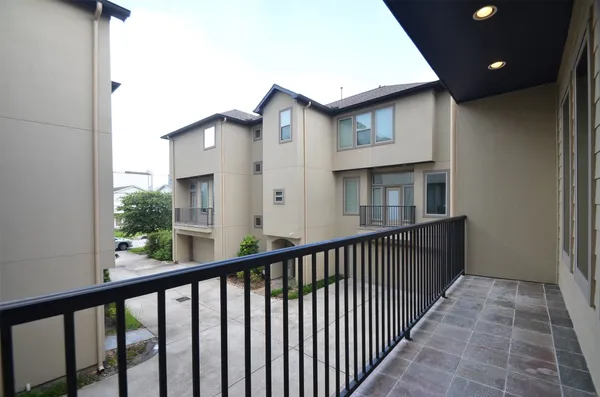a view of a balcony with wooden floor